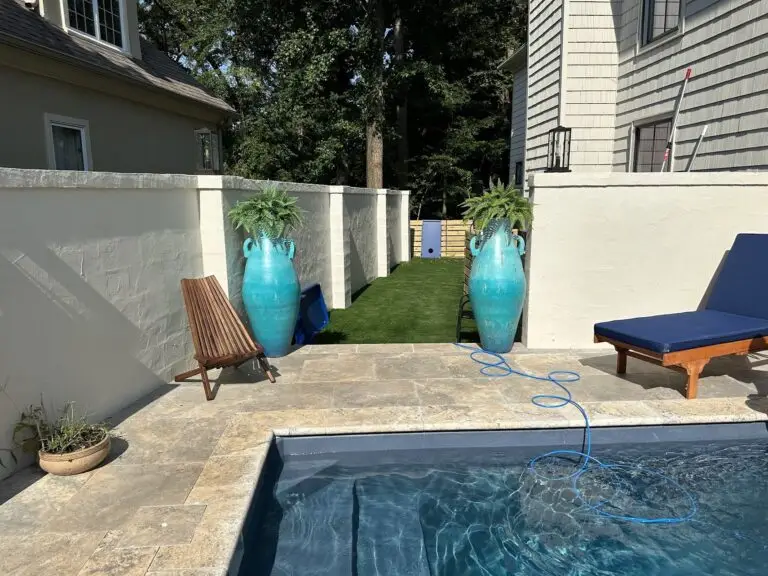 small plunge pool with tile coping deck, lounge chairs