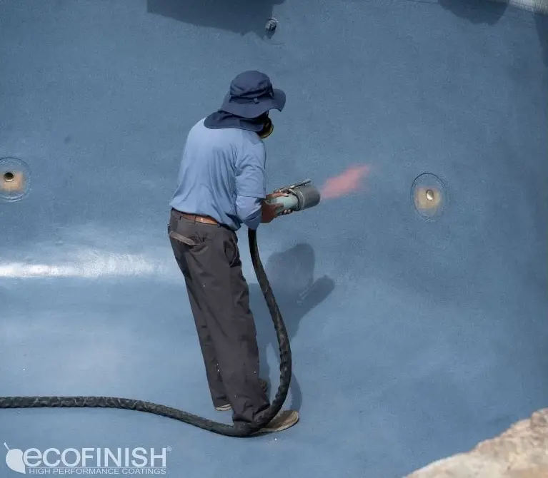 Man refinishing pool with ecofinish torch